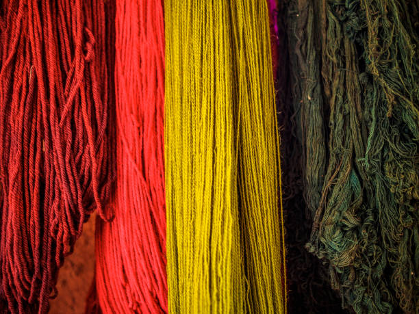 istock Close-up of hanging threads in a Peruvian textile workshop 864645246