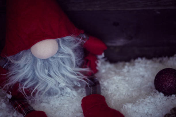 istock Christmas dwarf on snow with Christmas decorative close up 864648596