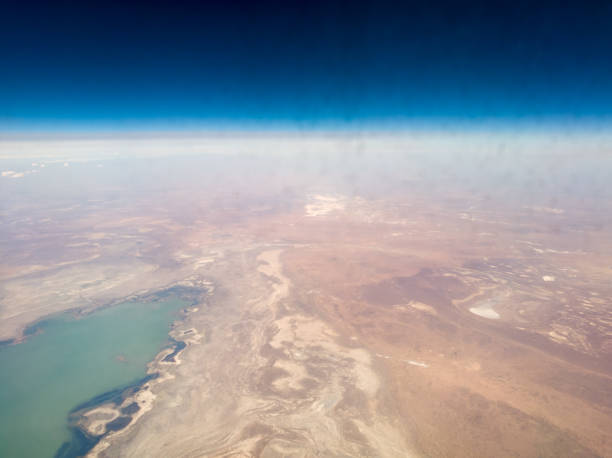 istock surface of the earth from the airplane window 864648896