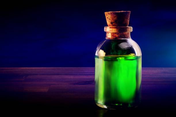 istock poison bottle on a wood surface 864655560