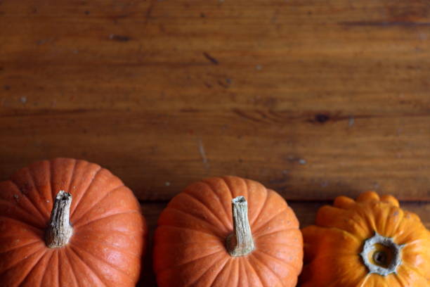 istock holiday frame: orange pumpkins closeup with space for letters, halloween pattern 864660868