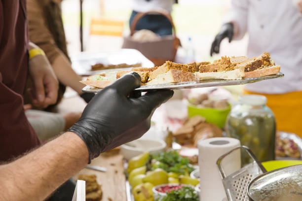 istock Man in black rubber gloves holds plate 864665366