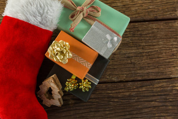istock Overhead view of Christmas presents with stocking 864668620