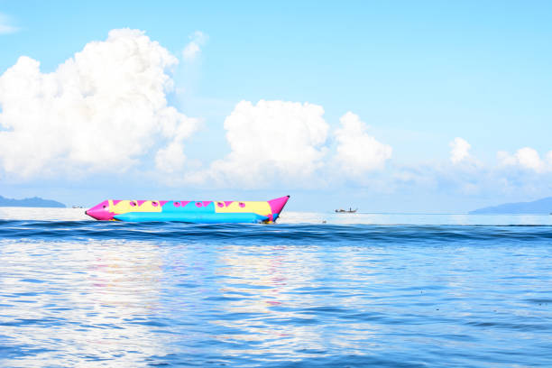 istock Banana boat on blue sea. 864669646