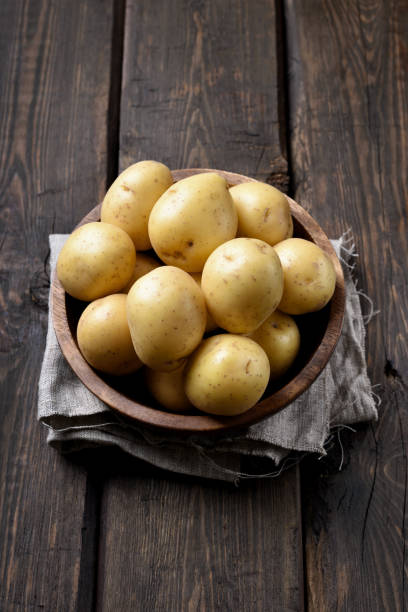 istock Raw potatoes in bowl 864673102