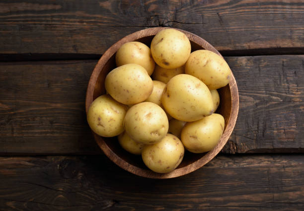 istock Raw potatoes in bowl 864673110