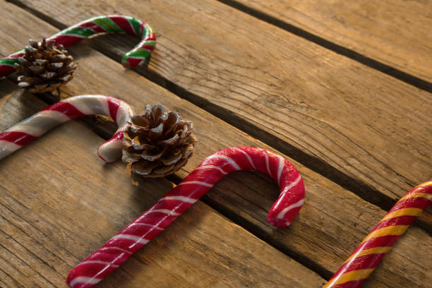 istock High angle view of colorful candy canes with pine cones 864673972