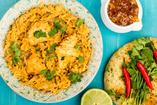 istock Chicken Biryani Curry With Rice And Naan Bread 864679016