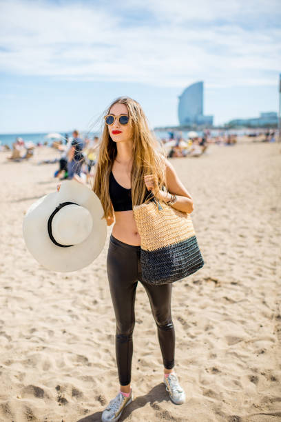 istock Woman on the Barcelona beach 864684562