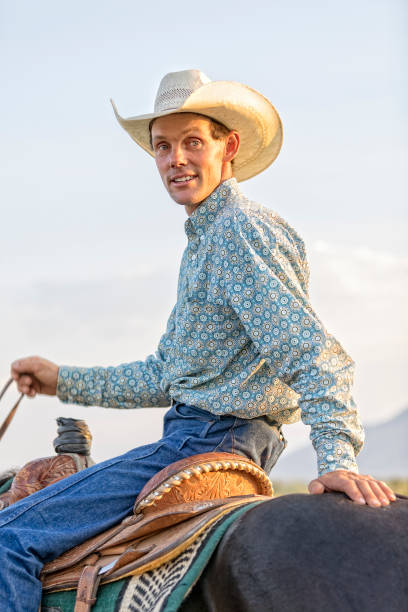 istock Cowboy sits on his horse 864684624