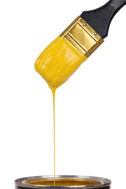 istock Yellow paint and brush 864697024