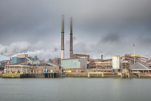 Steel mill in IJmuiden The Netherlands part of the Tata Steel Europe steel factory located on the Dutch coast during a cloudy day. The Indian company Tata Steel is negotiating a merger with the German Thyssenkrupp group.