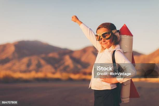 Young Business Girl With Rocket Pack Stock Photo - Download Image Now - Child, Rocketship, Determination