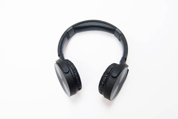 istock High angle view of a black wireless headphone working through bluetooth over isolated on white 864713256
