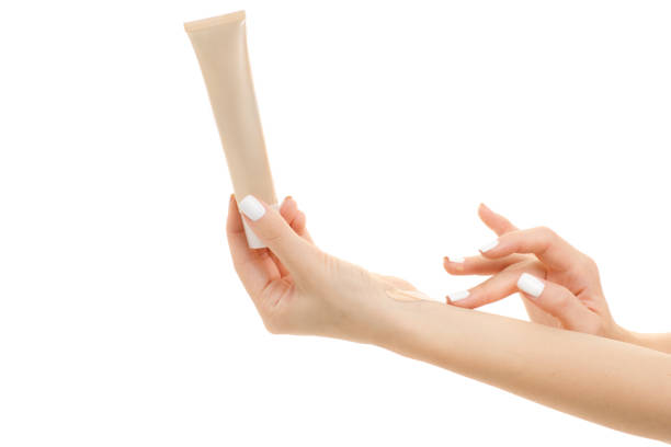 istock Female hand base cream beige 864713738