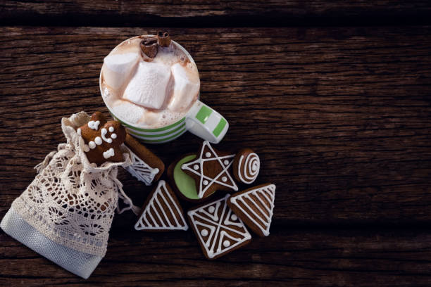 istock Various cookies and hot chocolate on wooden plank 864717032