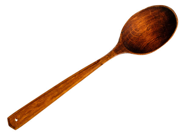 istock Old wooden spoon isolated on white 864717102
