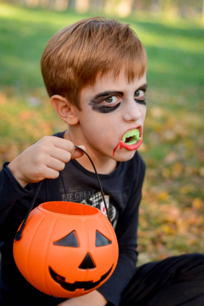 istock Little funny halloween vampire boy 864717548