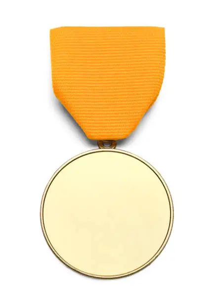Gold Medal WIth Copy Space and Ribbon Isolated on White Background.