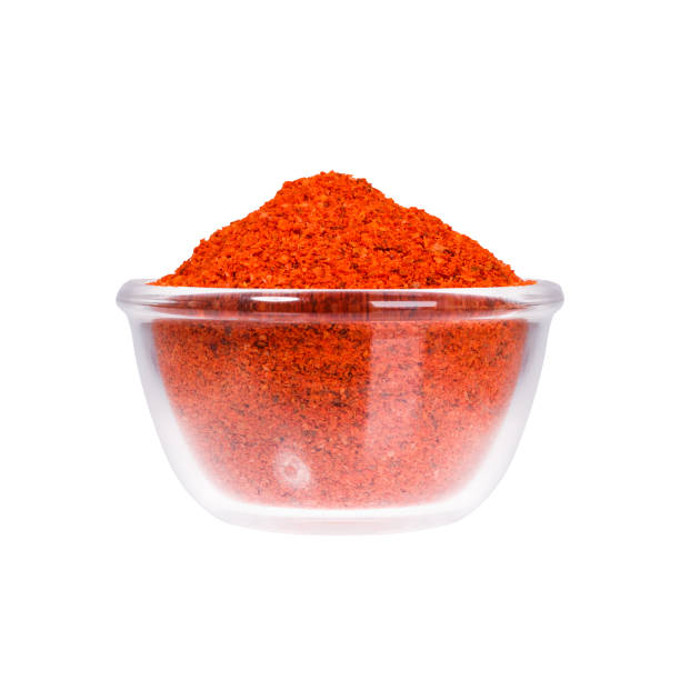 istock Sumac seeds in glass saucepan on white background 864717888