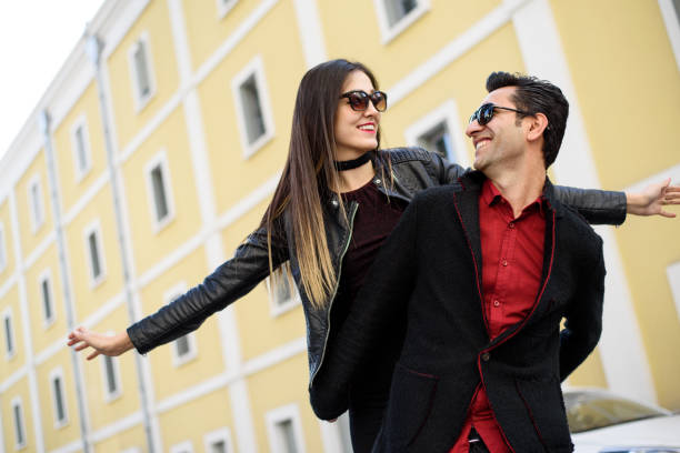 istock Young man piggyback her girlfriend 864735602