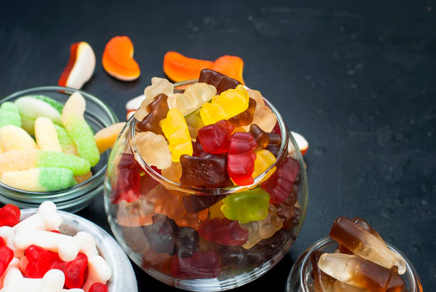 istock Tasty Different jelly candy on black background 864738644