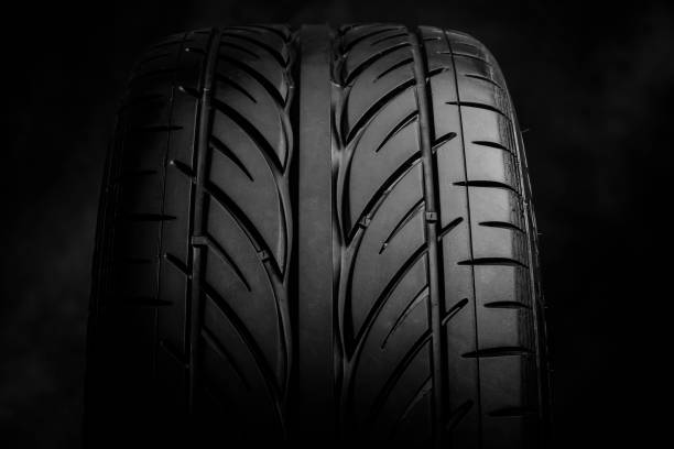istock Car tires on a dark background 864742866