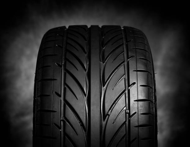 istock Car tires on a dark background 864742902