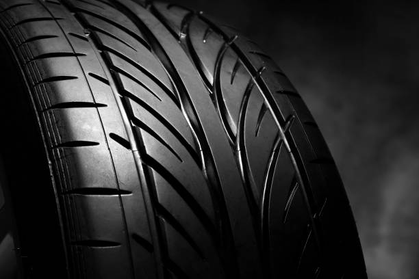 istock Car tires on a dark background 864742934