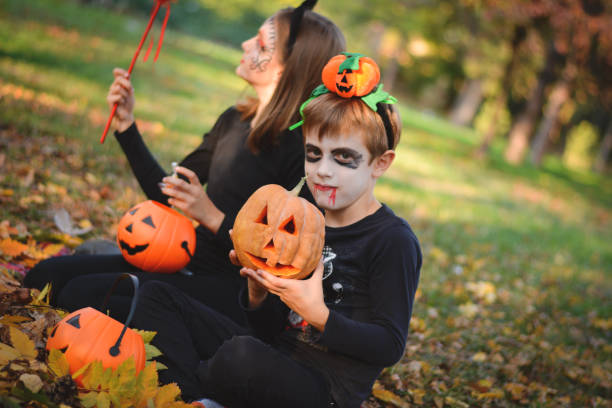 istock Children in autumn park at Halloween 864746050