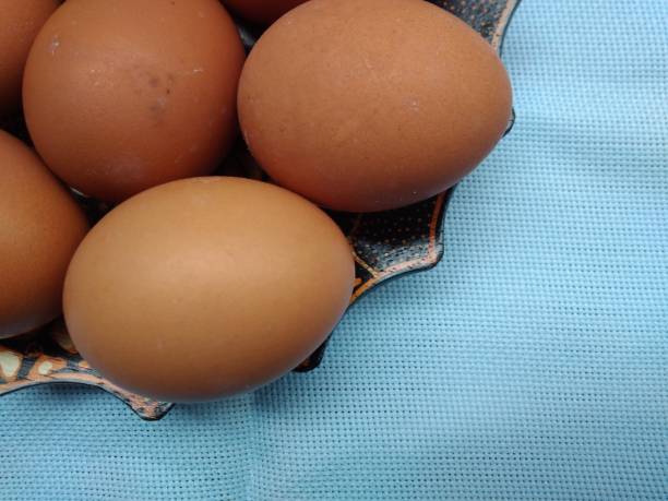 istock Stack of Eggs at Batik Wooden Plate 864749760