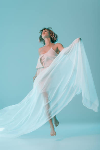 istock tender girl jumping with veil 864749914