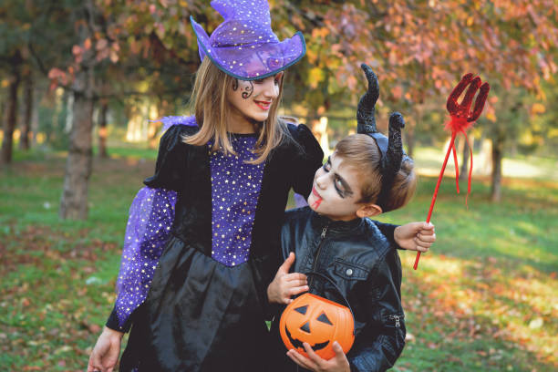 istock Children in autumn park at Halloween 864752508