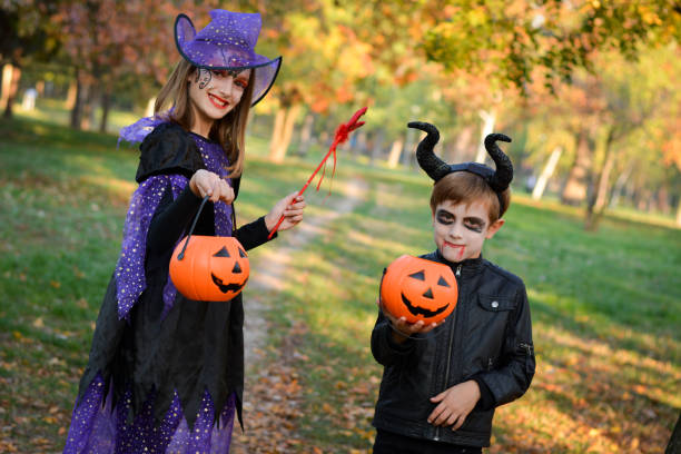 istock Children in autumn park at Halloween 864752888
