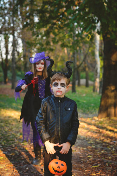 istock Children in autumn park at Halloween 864753362