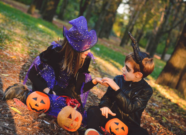 istock Children in autumn park at Halloween 864753544