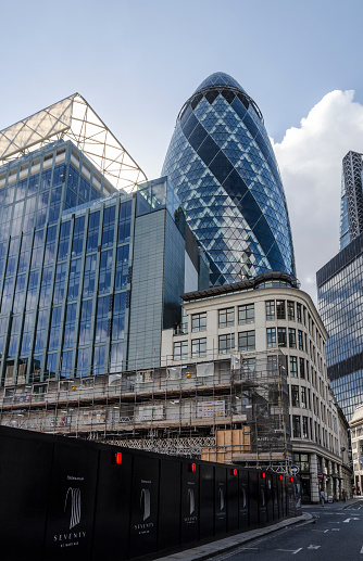 The view of the Gherkin from St Mary Axe next to the construction site for 