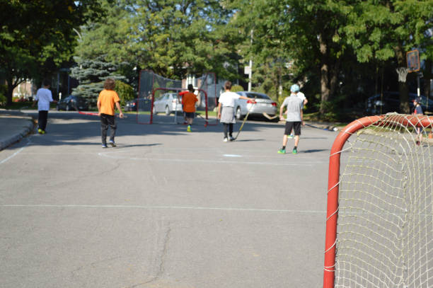 Kid Playing The Sport Street Hockey Stock Photo - Download Image Now - Roller  Hockey, Summer, Child - iStock