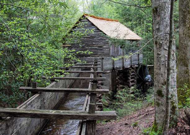 istock Historic gristmill with water wheel 864763476