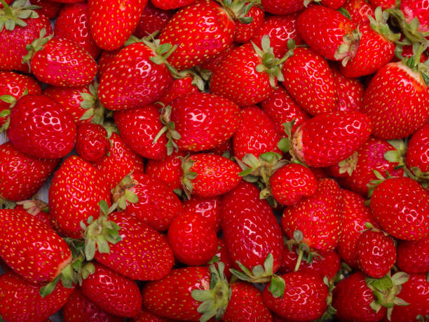istock A top view on a fresh ripe strawberries. Food concept. 864763548