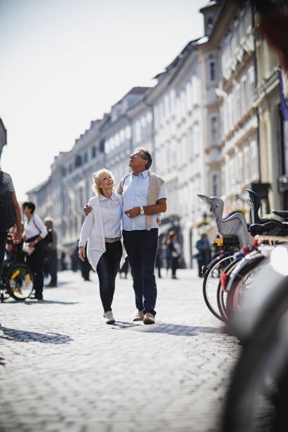 Senior Couples walking around the city stock photo