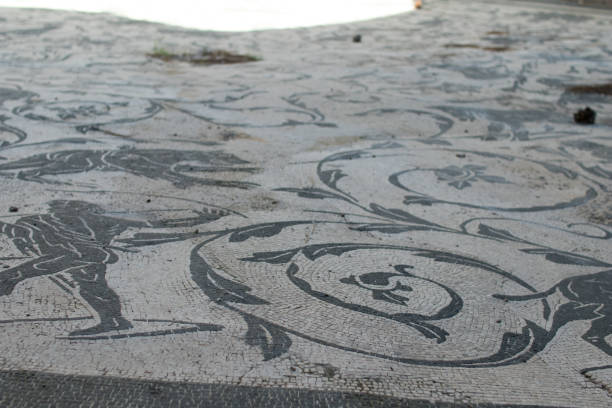 istock Mosaic in ancient Rome with small white and black tiles 864771756