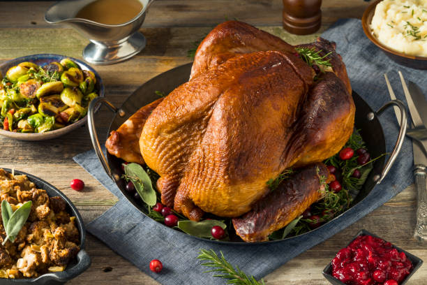 istock Organic Homemade Smoked Turkey Dinner for Thanksgiving 864775278