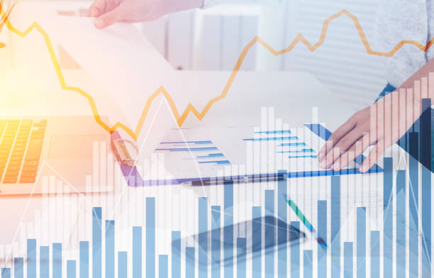 istock Businesswoman s hands, graphs, office 864777420