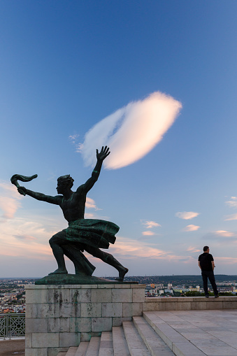 Liberty Statue in Budapest, Hungary. The Liberty Statue or Freedom Statue is a monument on the Gellert Hill in Budapest, Hungary. It commemorates those who sacrificed their lives for the independence, freedom, and prosperity of Hungary.