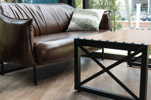 istock table, chair, brown leather sofa near window at restaurant or cafe 864793594
