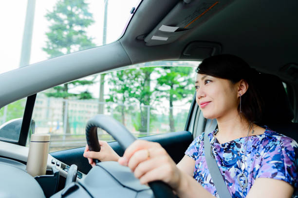 istock Woman driving a car 864797144