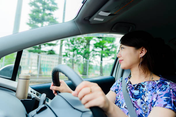 istock Woman driving a car 864797178
