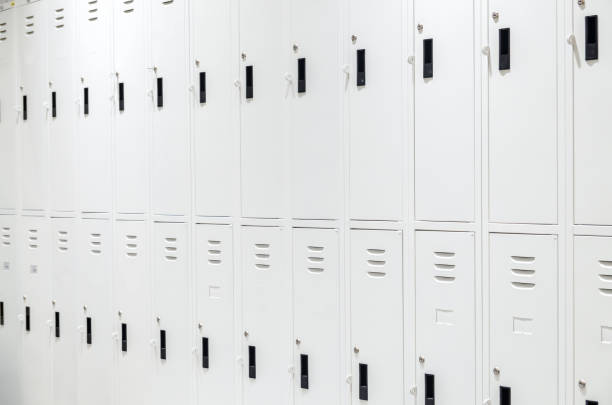 istock row of white locker to storage 864804558