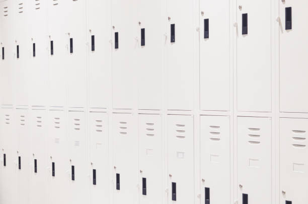 istock row of white locker to storage 864804566